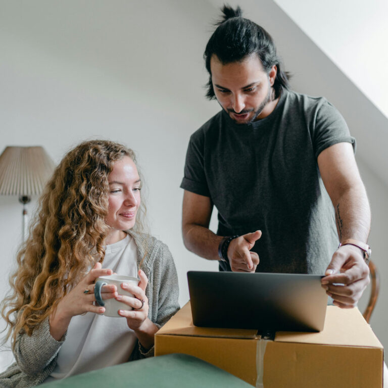 Couple looking at a computer together