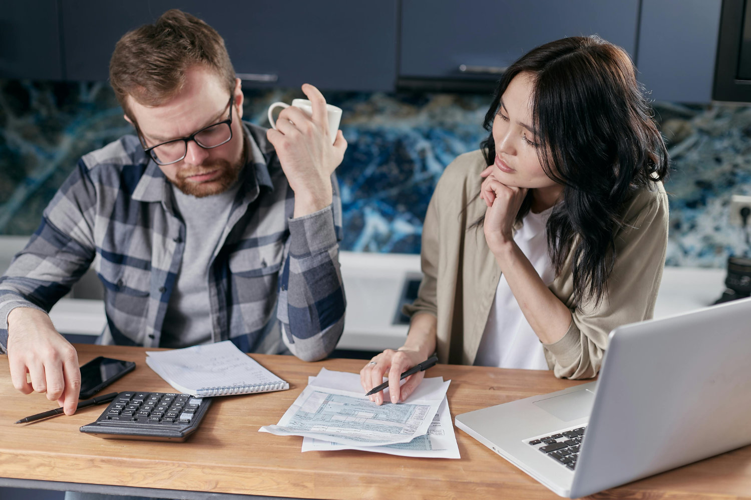 Worried couple at table